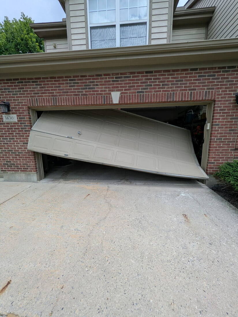 Garage door collapsed off its tracks before repair