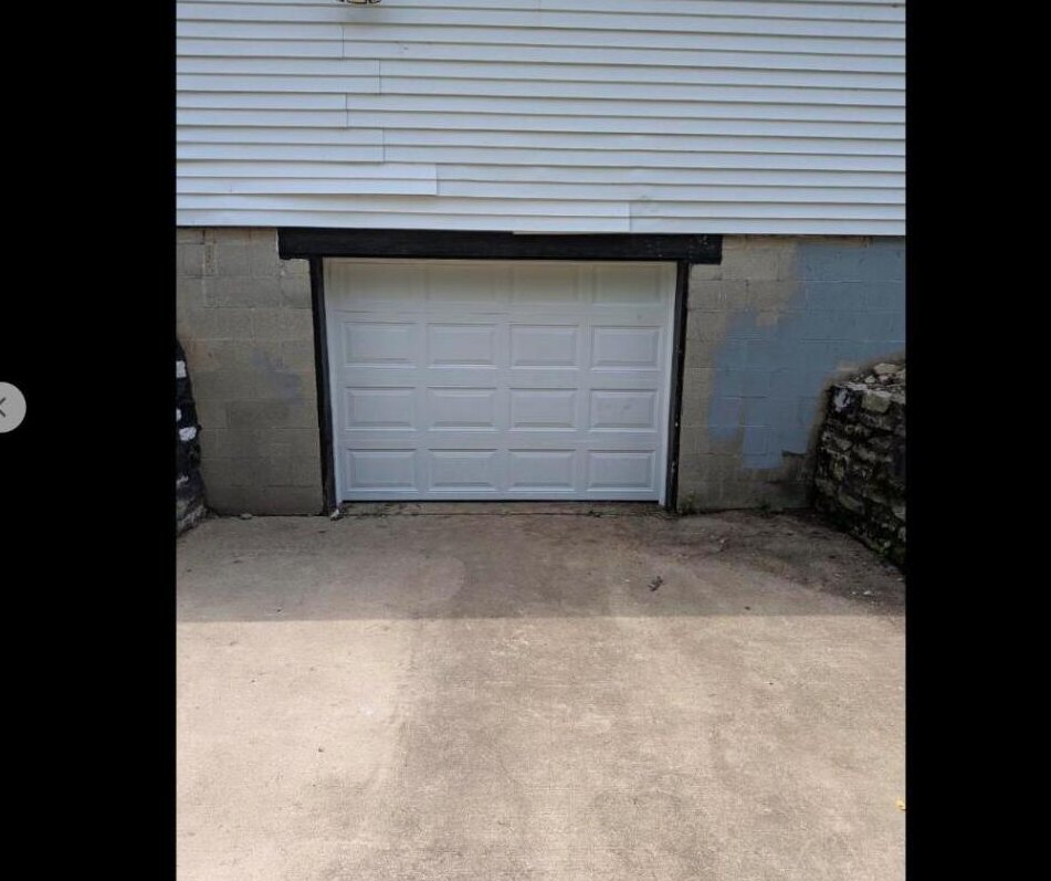 New residential garage door installed clean and level