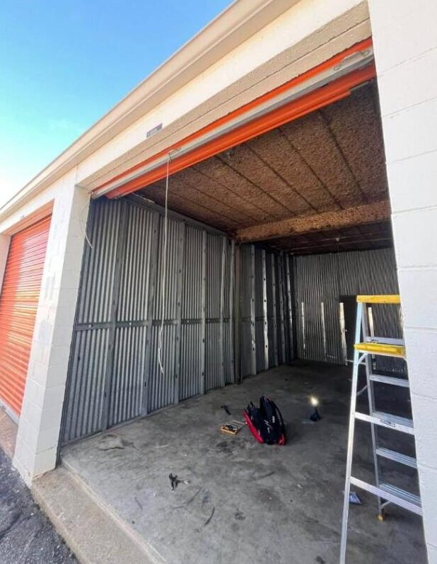 Technician working on a storage unit door