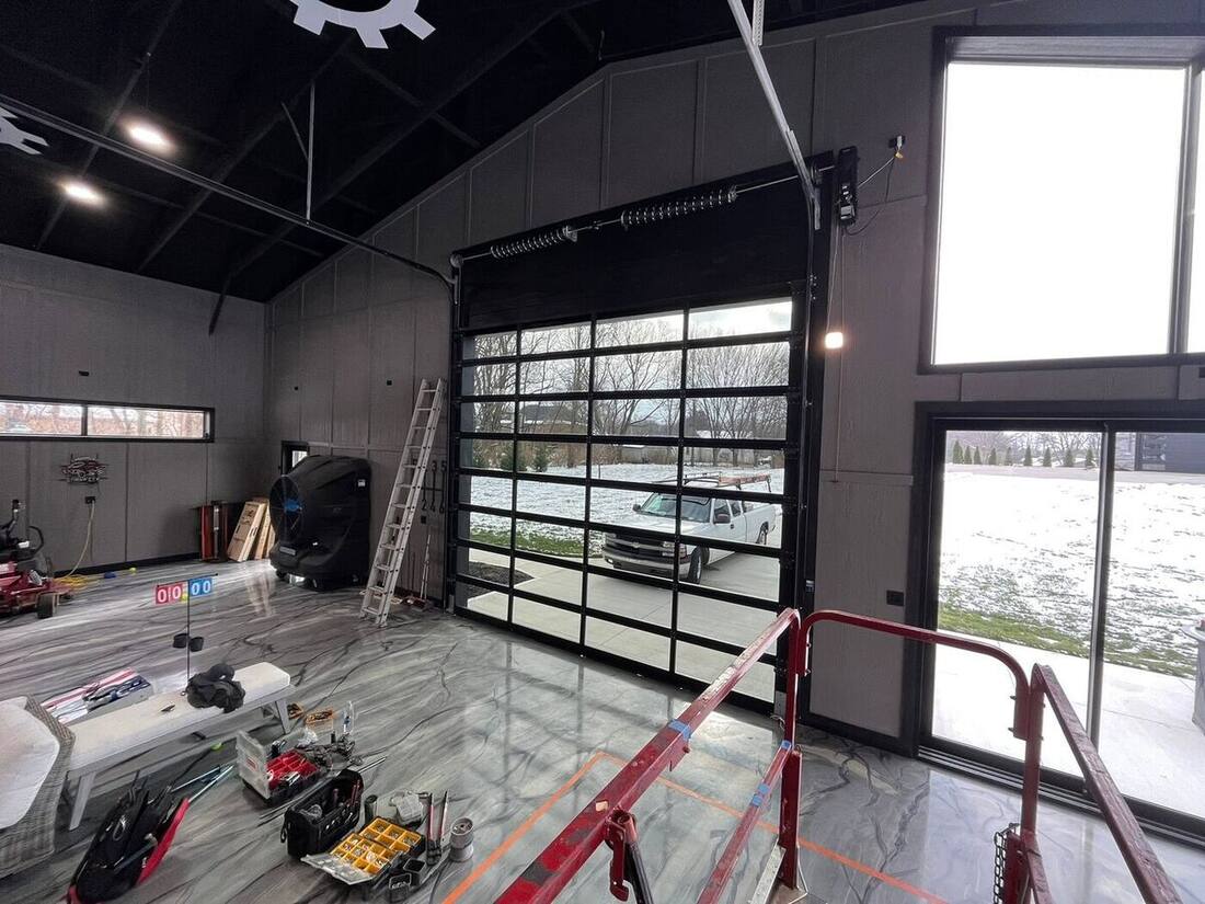 Modern full-view glass garage door installed