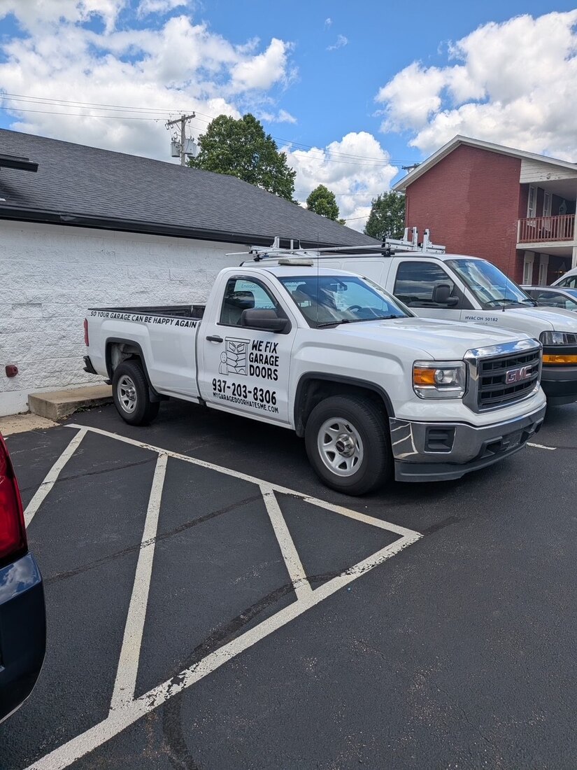 We Fix Garage Doors branded service truck on a job